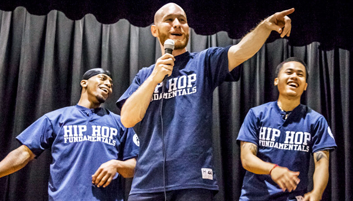 Three members of Hip-Hop Fundamentals performing on a stage