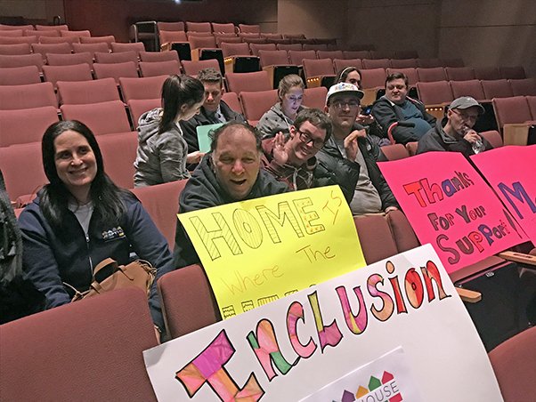 JESPY clients with signs at a meeting