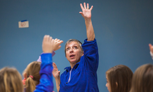 Young Audiences teacher-artist Laura Marchese leads a dance class for schoolchildren