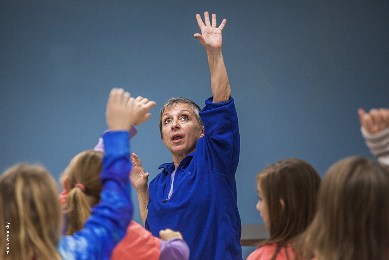 Young Audiences teaching artist Laura Marchese leads a dance class for young schoolchildren