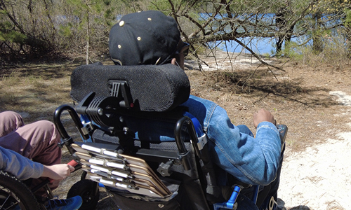 Wheelchair user on trail in Pinelands