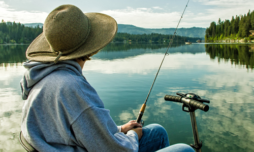 Woman fishing at lake